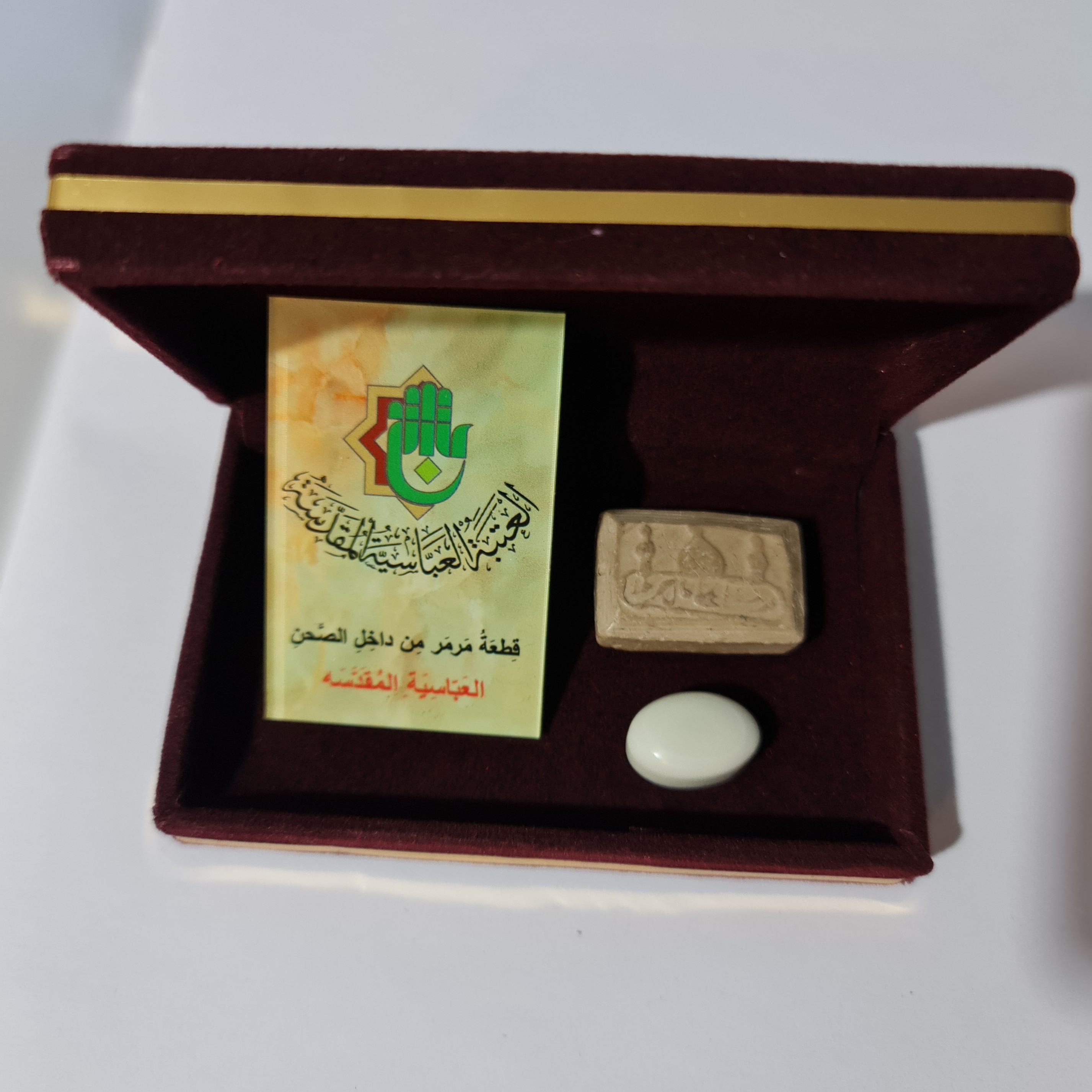 نگین انگشتر سنگ حرم حضرت عباس همراه با فاکتور اصالت کالا از عتبه( سایز متوسط ) همراه هدیه مهر حرم امام حسین کربلا